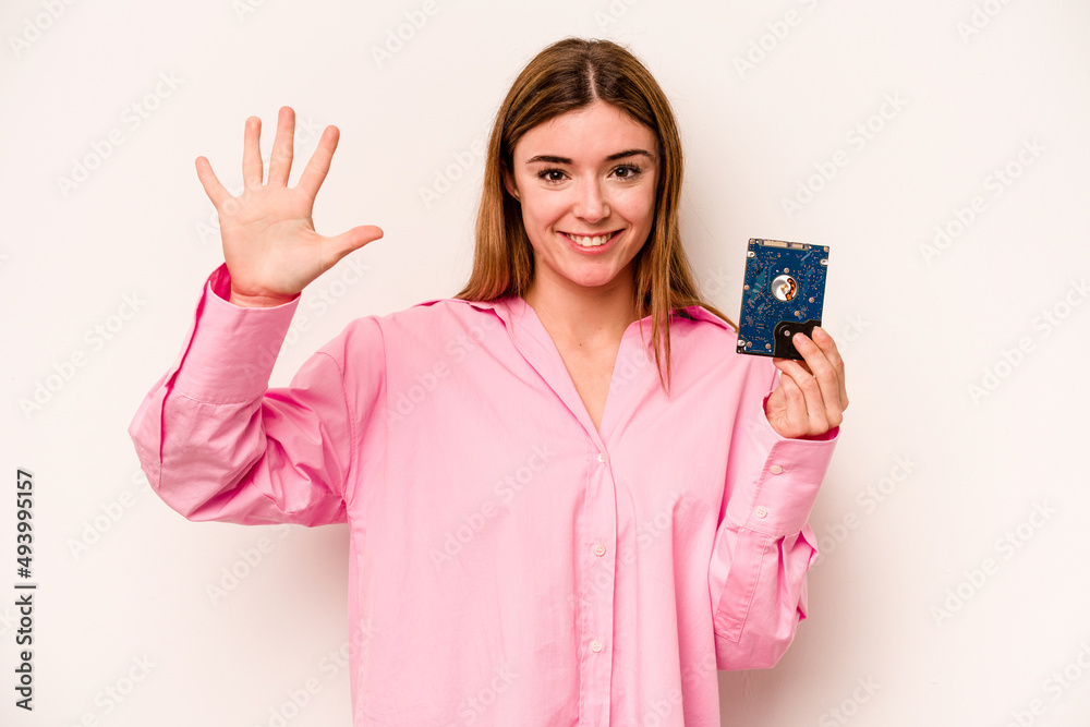 Young informatic caucasian woman isolated on white background smiling cheerful showing number five with fingers. Young informatic caucasian woman isolated on white background smiling cheerful showing number five with fingers.