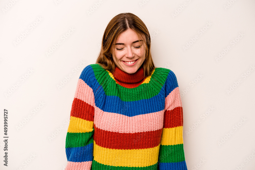 Young caucasian woman isolated on white background laughs and closes eyes, feels relaxed and happy. Young caucasian woman isolated on white background laughs and closes eyes, feels relaxed and happy.