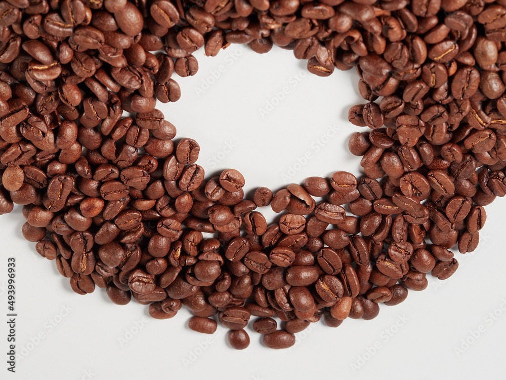 Coffee beans isolated on white background with copyspace for text. Coffee background or texture concept. Coffee beans isolated on white background with copyspace for text. Coffee background or texture concept.