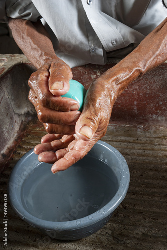 Coronavirus prevention, covid 19 in rural Guatemala, man washing hands,