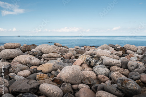 Rocks and stones on the beach in Normandy, France.