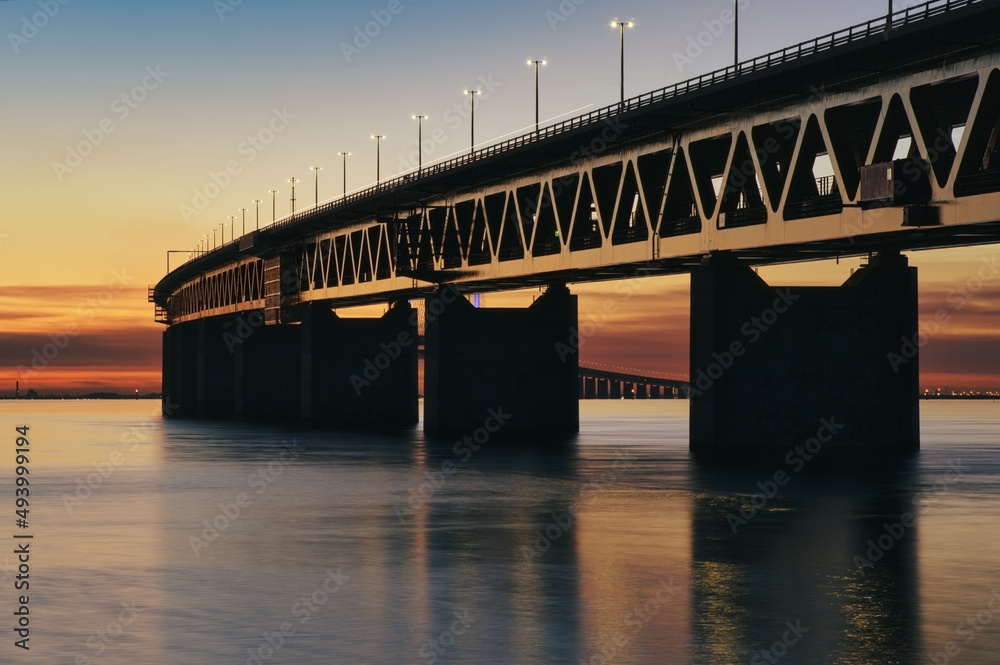 The Oresund Bridge between Denmark and Sweden at sunset The Oresund Bridge between Denmark and Sweden at sunset