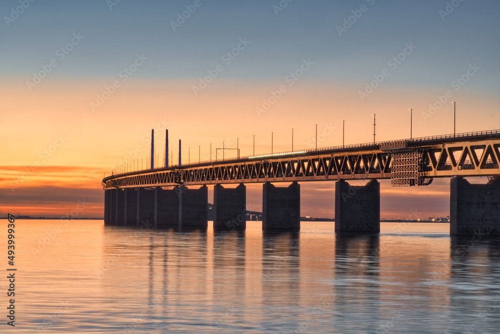 The Oresund Bridge between Denmark and Sweden at sunset
