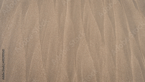Closeup of sand texture on a beach in Christchurch, New Zealand