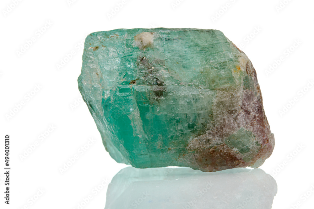 macro mineral stone emerald on a white background macro mineral stone emerald on a white background