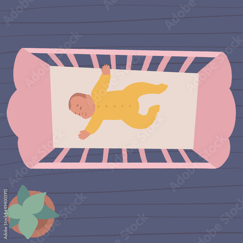 Cute little baby in crib. Infant in bed sleep peacefully. Healthy sleep at night.