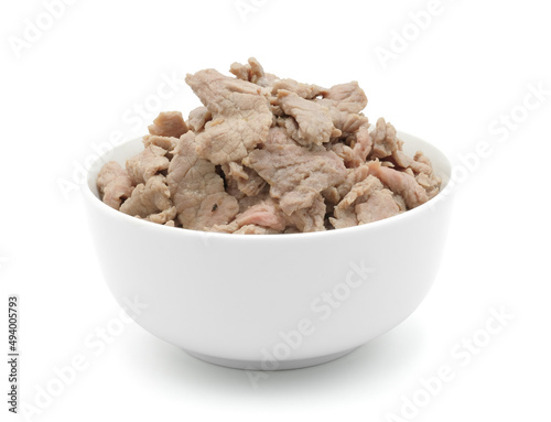 Beef sliced in ceramic white bowl isolated on white background with clipping path.