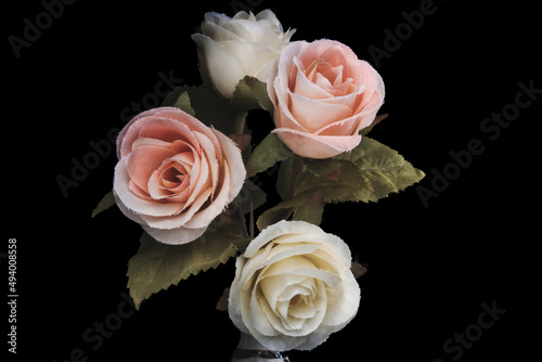 Vintage flower style,pink rose and white rose on black background,made of cloth