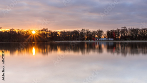 Evening view with reflections in the Silbersee, Germany, Lower Saxony, Hanover, Langenhagen photo