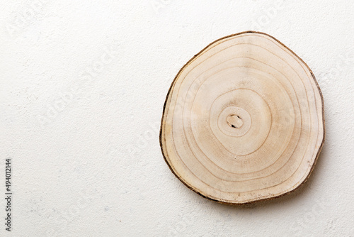 Top view of wooden serving tray on cement background. Empty space for your design