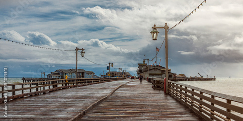 The iconic Stearns Wharf, in Santa Barbara, California, USA, with a moody and dramatic sky photo