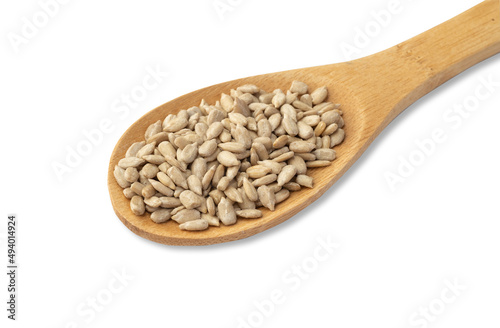 Sunflower seeds in a spoon isolated over white background