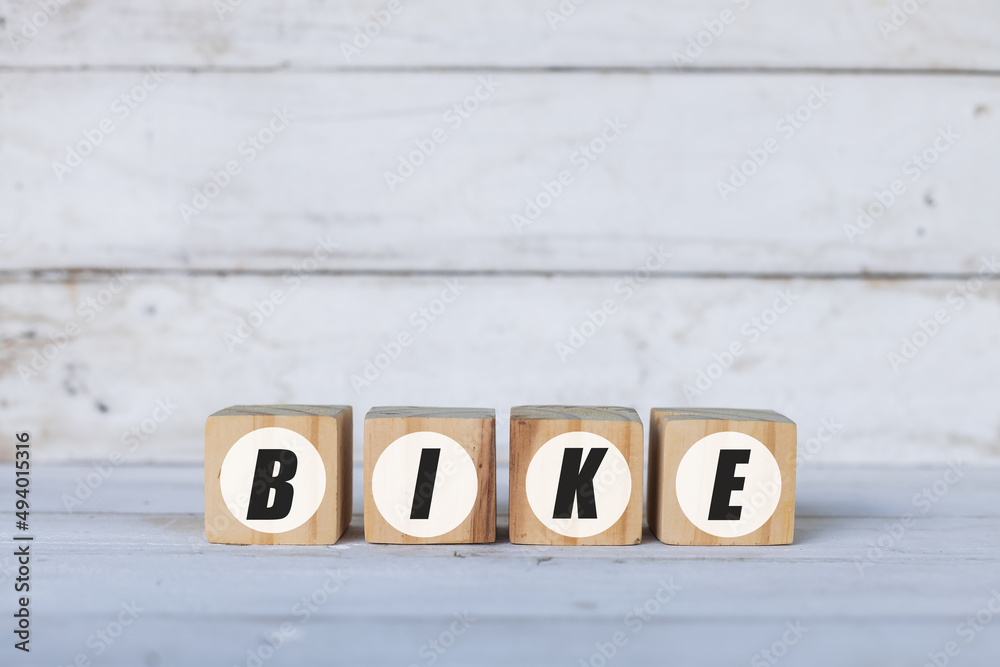 bike concept written on wooden cubes or blocks, on white wooden background. bike concept written on wooden cubes or blocks, on white wooden background.