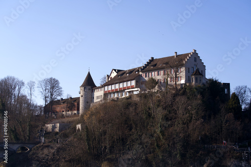 Laufen Castle on a hill above the famous Rhine Falls on a sunny spring day. Photo taken March 5th, 2022, Laufen-Uhwiesen, Switzerland. © Michael Derrer Fuchs