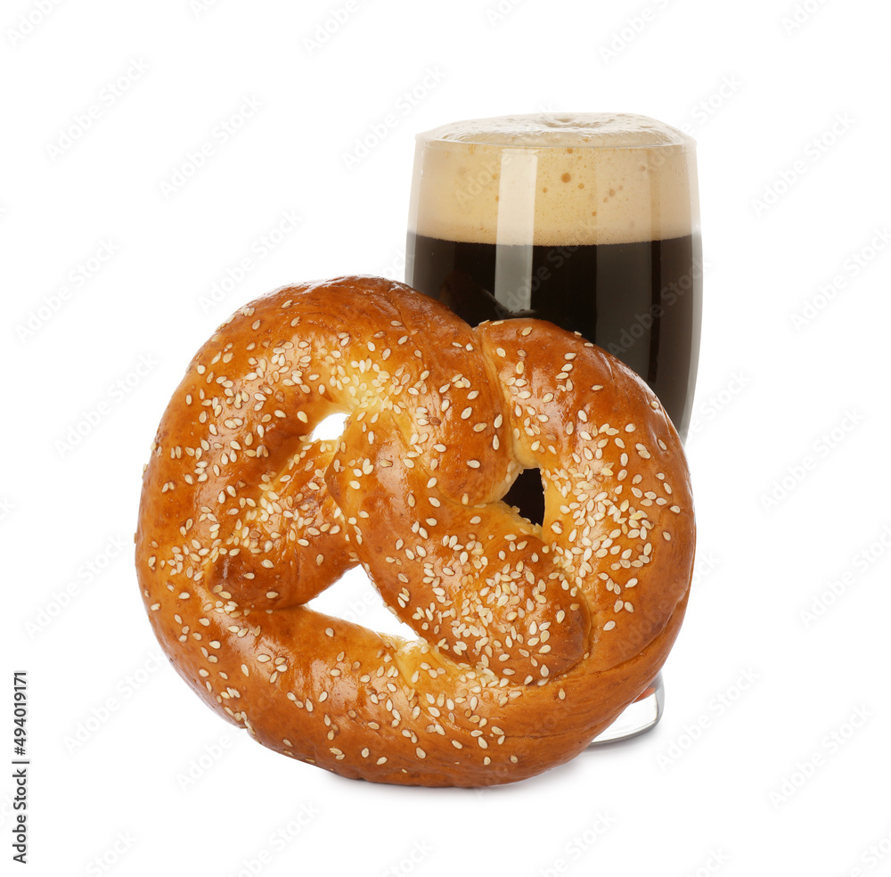 Tasty freshly baked pretzel and glass of dark beer on white background Tasty freshly baked pretzel and glass of dark beer on white background