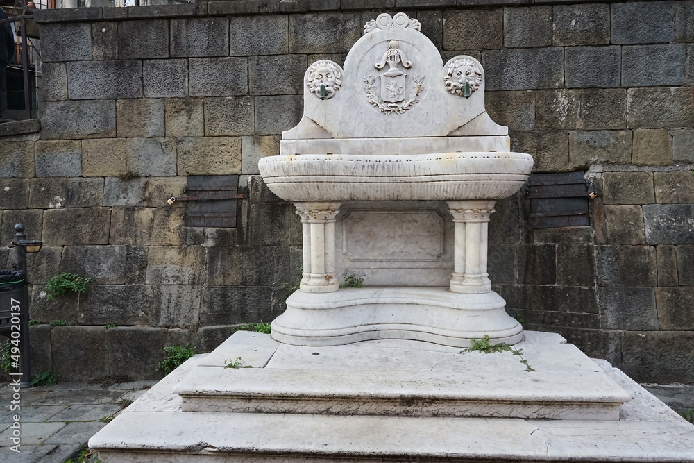 Fountain in Umberto square in Castelnuovo Garfagnana, Tuscany, Italy