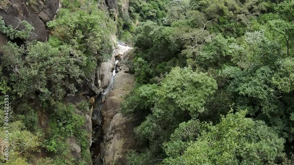 Top down cinematic shot of Sri Lanka canyon at Ravana Falls in South Asia, aerial view Top down cinematic shot of Sri Lanka canyon at Ravana Falls in South Asia, aerial view
