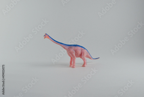 diplodocus.herbivorous dinosaur, plastic toy on a white background. photo