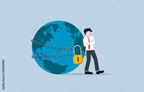 Market dominance or monopoly company, possession or control of supply or trade in goods or services concept. Confident businessman chained and padlocked globe metaphor for monopoly. 