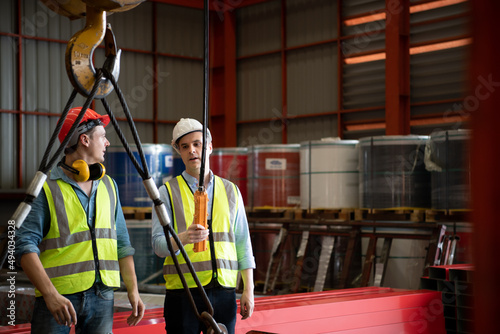 Two young engineers Testing and checking the operation of the semi gantry crane