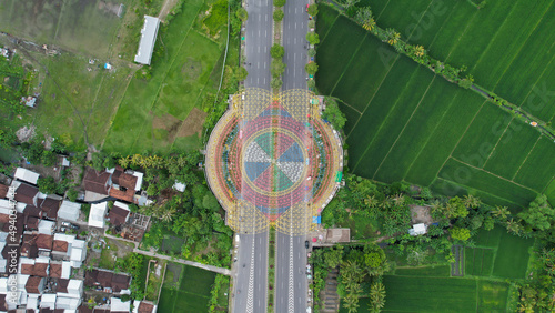 Aerial view of the city colorful Monument Tembolak Rainbow on Mataram. The newest icon from the city of Mataram Indonesia. Lombok, Indonesia, March 22, 2022 photo