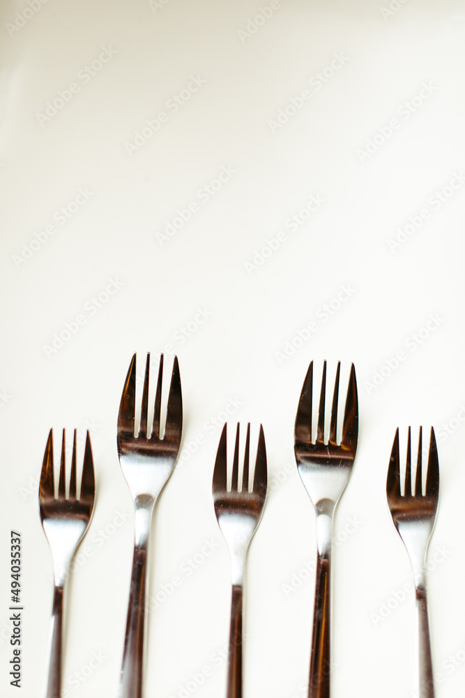 Vertical Shot of Forks on White Background Vertical Shot of Forks on White Background