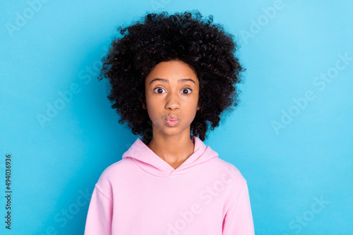 Photo of young pretty girl send air kiss romantic feelings valentine day isolated over blue color background © deagreez