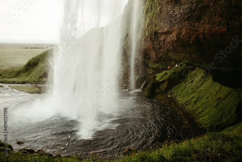 A Waterfall in Iceland Flowing into a Pond
