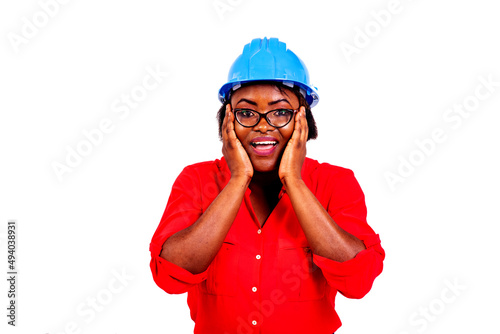 surprised engineer woman holding both hands on her cheeks smiling.