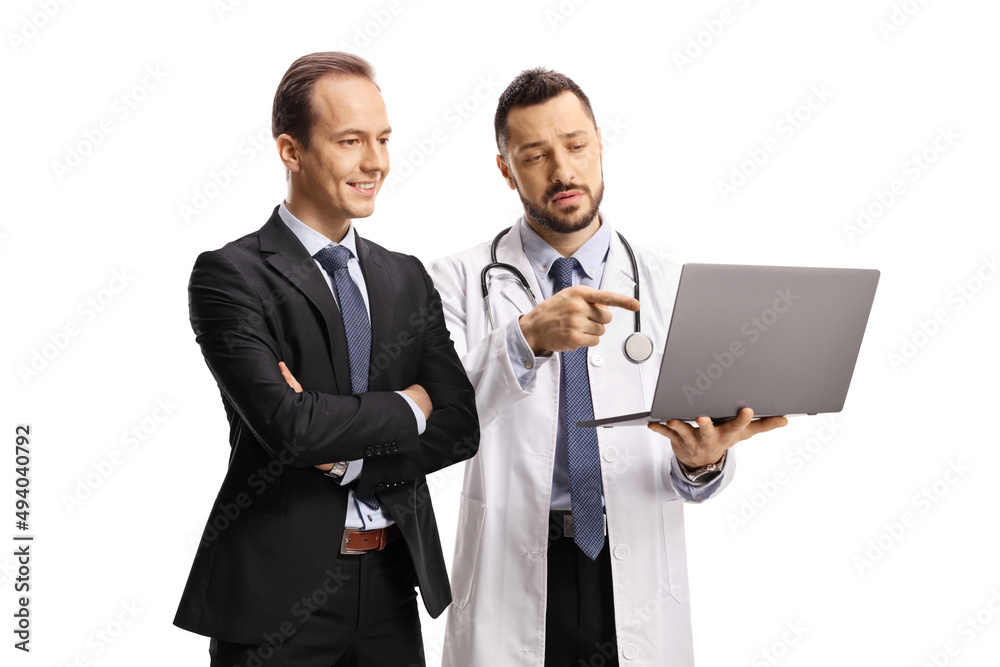 Male doctor showing a laptop screen to a businessman Male doctor showing a laptop screen to a businessman