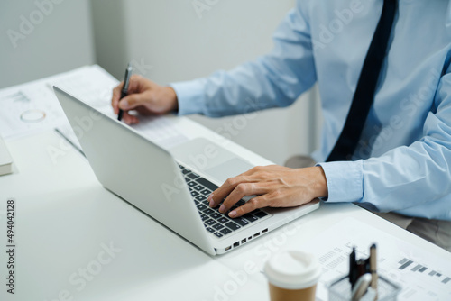Business Professional Accountant Woman working on laptop computer making research for planning startup at desktop working process in office