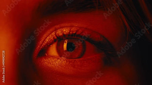 Stunning female blue eyes with red light