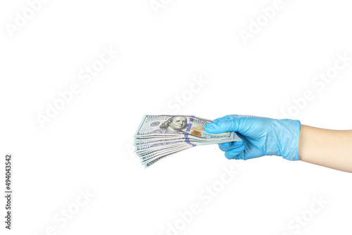 Hand in blue medical glove giving money on white background. Money Financial and Payment Concept.