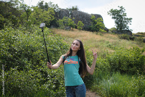 Girl taking selfie on beautiful Ukrainian nature background photo