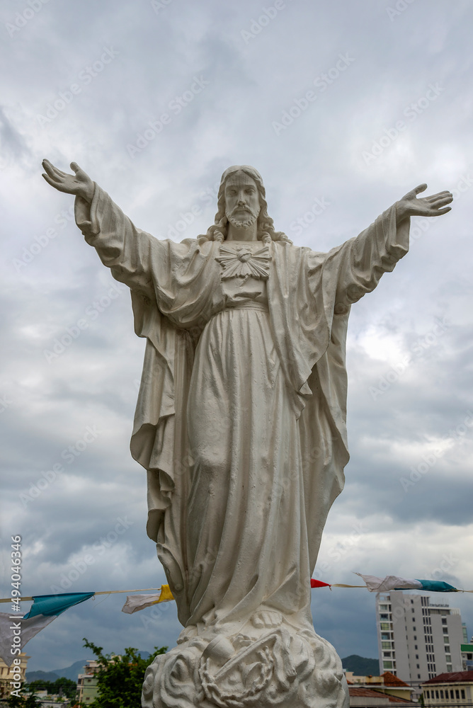 Fototapeta premium Sculpture of Christ close-up at the entrance to the Cathedral of Nha Trang. Vietnam