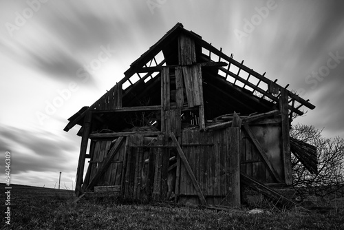 front view of an old spooky abandoned barn