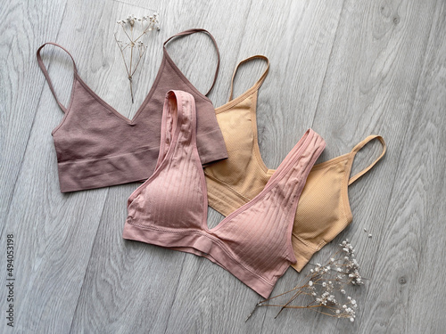 Fotografie Three different bra tops, top view