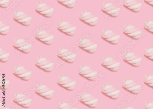 Marshmallow. Seamless pattern. Swirl two-tone puff candies on pastel pink backdrop. 