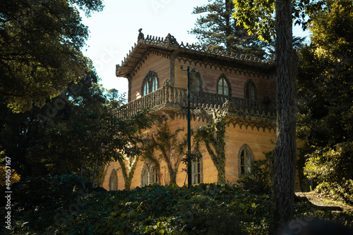 Vertical shot of Chalet of the Countess of Edla in Estrada da Pena, Sintra, Lisbon, Portugal photo