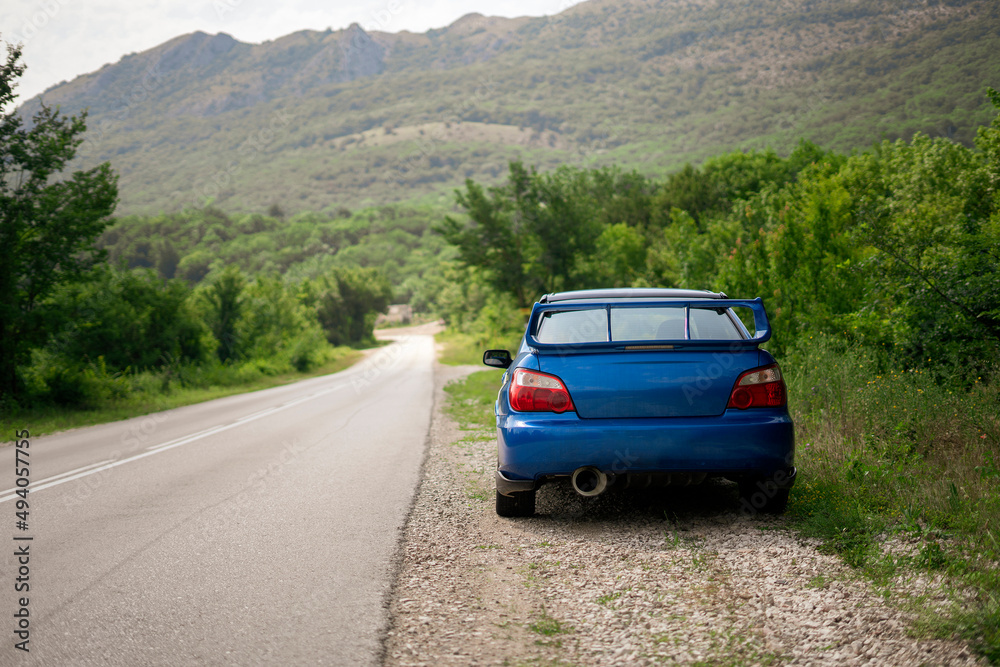 blue car on the road, travel vacation roadtrip journey