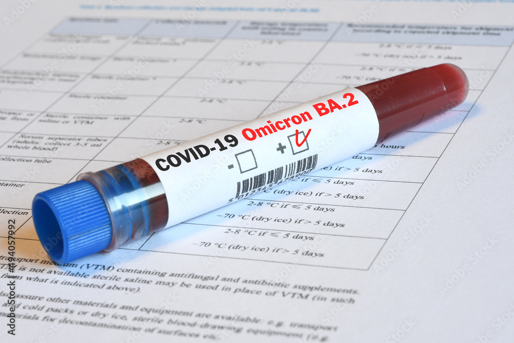 Blood tube for test detection of virus Covid-19 Omicron BA.2 Variant with positive result on papers document. Blood tube for test detection of virus Covid-19 Omicron BA.2 Variant with positive result on papers document.