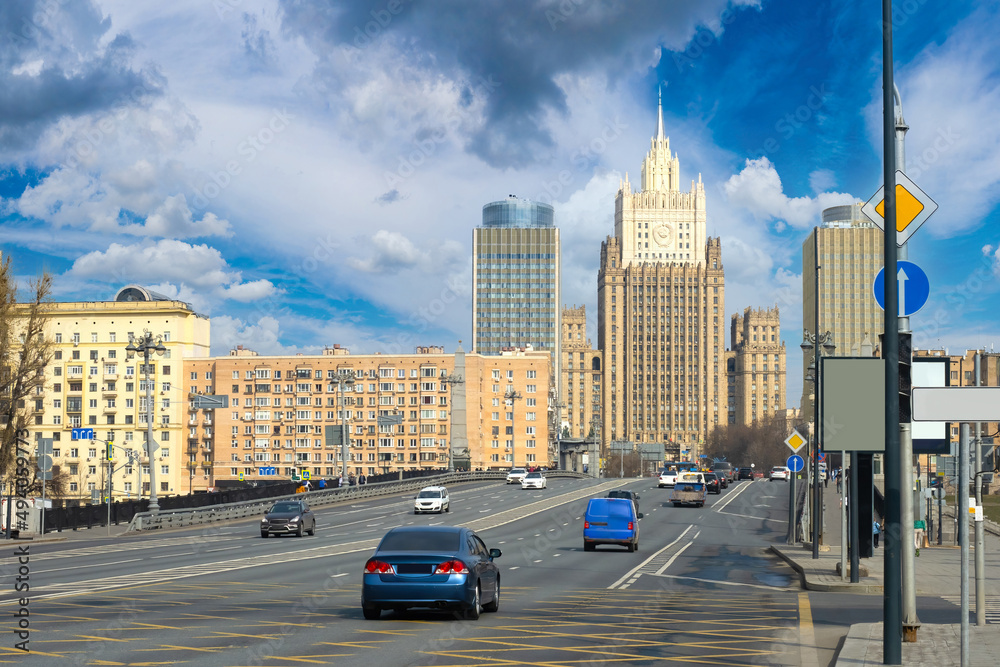 Moscow roads. Russian architecture. Cars drive along road in center of Moscow. Road architecture of capital. Moscow streets. Automobile travel to capital of Russia. Russian Federation.