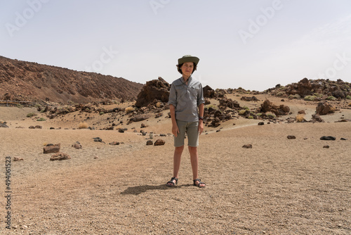 Portrait of a teenager on the background of rocks.