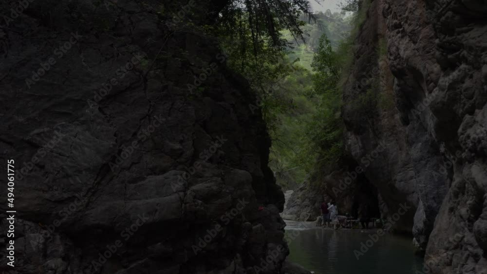 Close aerial shot of mountains with river 
