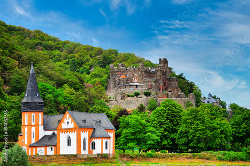 Mesmerizing view of the Reichenstein Castle amid dense greenery on the Rhine River in Germany photo