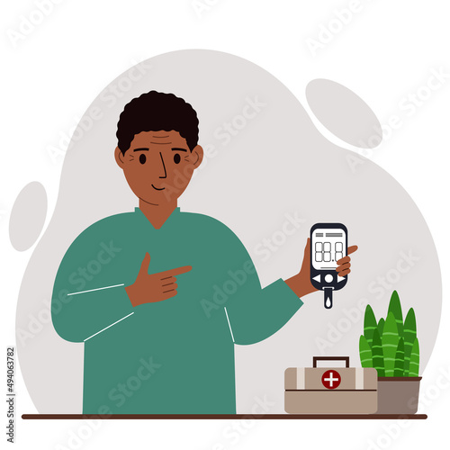 Happy man holds a glucometer in his hand. The concept of blood sugar control, diabetic.