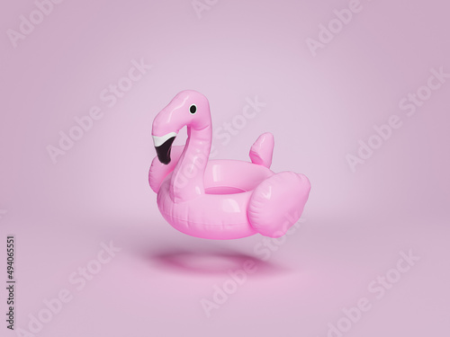 flamingo float suspended on pink background