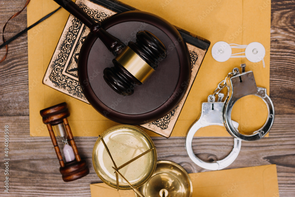 Fototapeta premium justice and law concept.Male judge in a courtroom on wooden table and Counselor or Male lawyer working in office. Legal law, advice and justice concept.