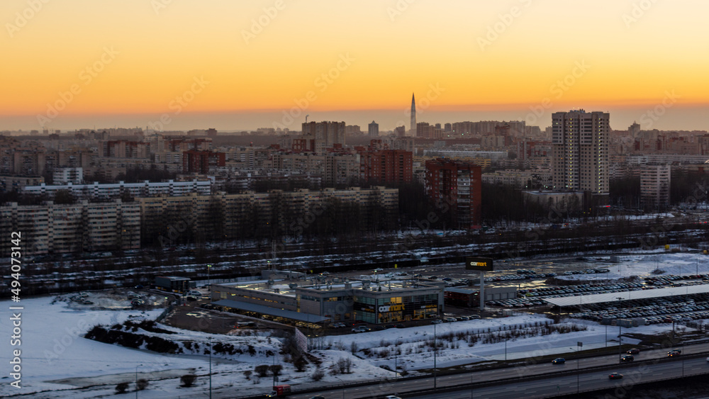 Urban landscape with residential buildings at sunset