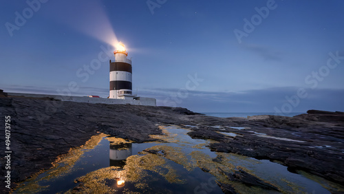 Evening scene of the Hook Head Lighthouse in County Wexford, Ireland photo